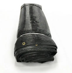 Cement blanket rolled for storage, reinforced woven poly skin in black and silver