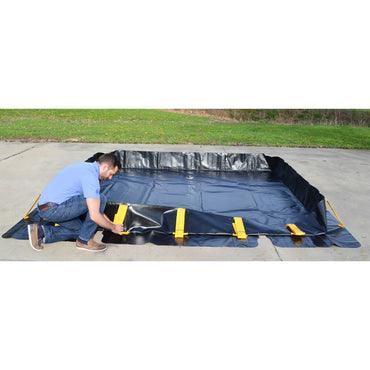 Stinger spill berm setting up for containing drums on job site