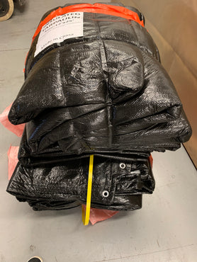 Black insulated blankets in warehouse stock for construction sites.